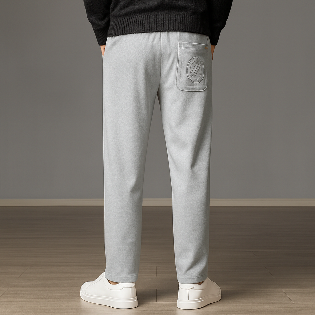 Back view of men's light gray ice silk drawstring sweatpants with embroidered back pocket, paired with white sneakers.