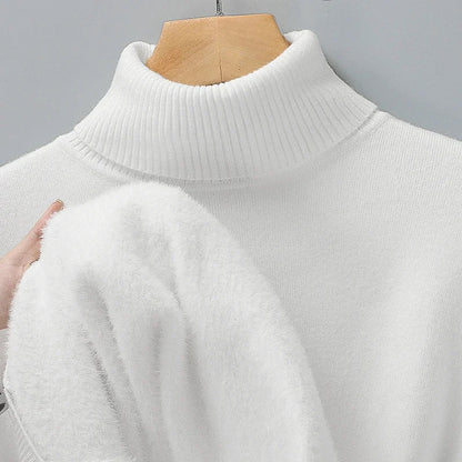 White merino wool turtleneck sweater on mannequin, hand lifting fabric to show soft plush interior lining