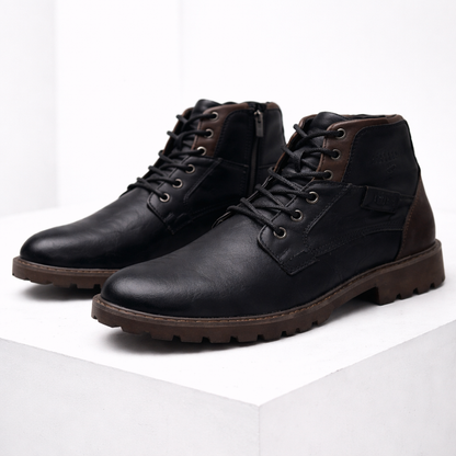 Black leather men's ankle boots with brown sole, lace-up closure, side zipper, and two-tone contrast detailing.