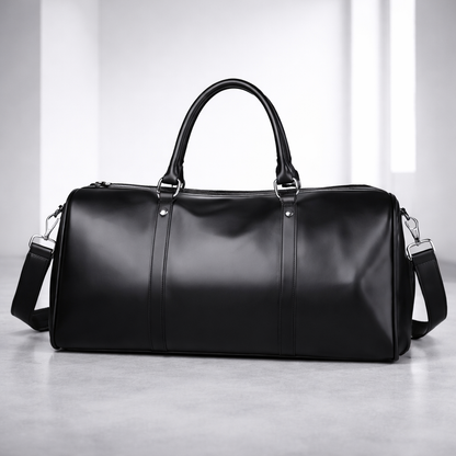 Black full-grain leather men's duffle bag with top handles, shoulder strap, silver hardware, and sleek structured design.