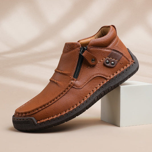 Men's brown leather slip-on ankle boots with side zipper and black rubber sole