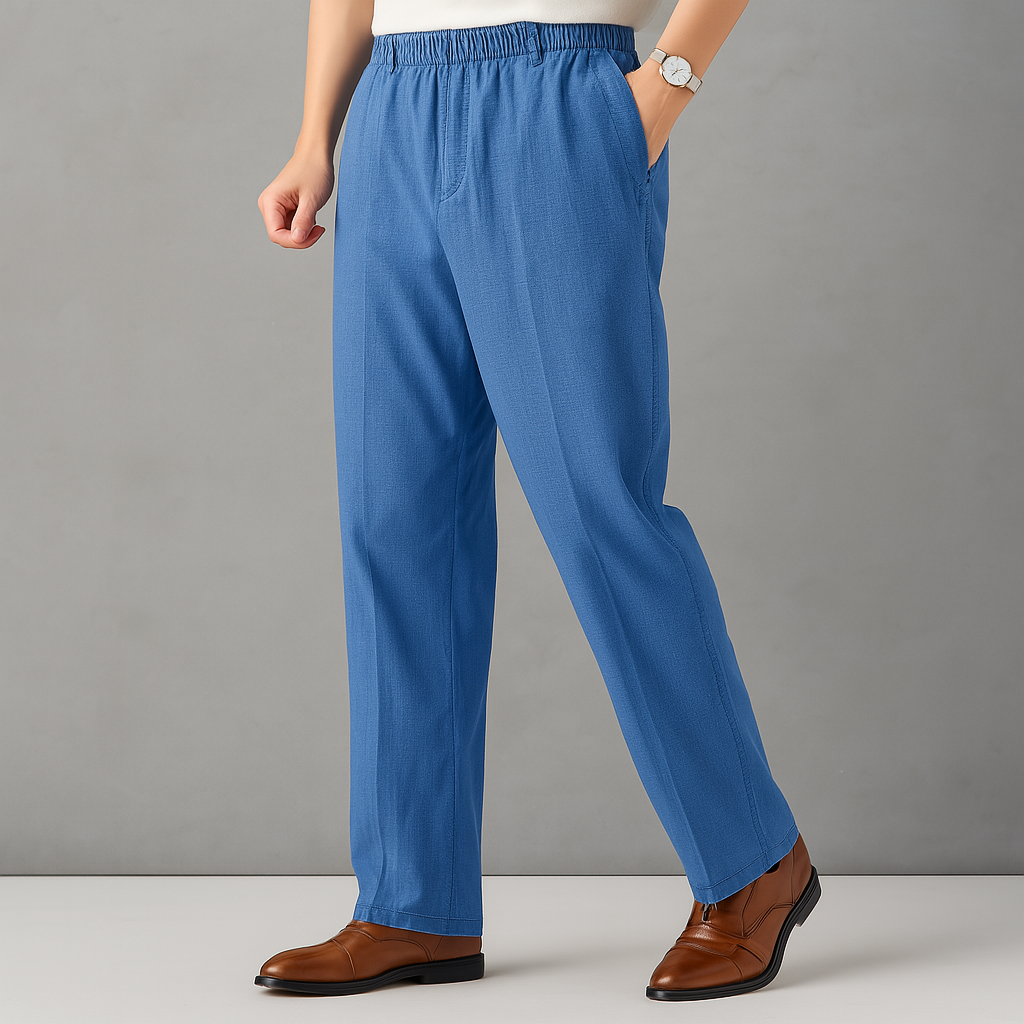 Men's blue linen drawstring pants with elastic waist and side pockets, worn with brown leather shoes