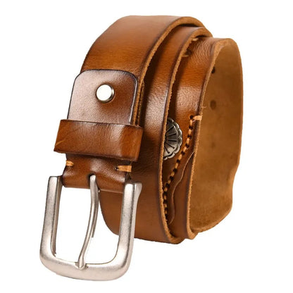 Tan brown genuine leather men's belt with silver pin buckle, hand-stitched edges, and decorative metal concho detail