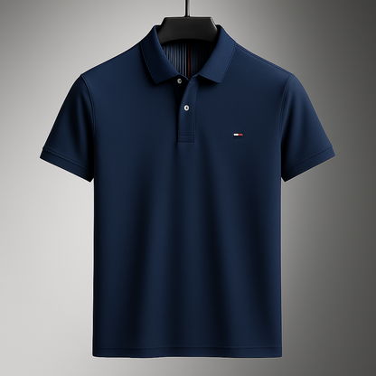 Navy blue men's cotton polo shirt with collar, short sleeves, button placket, and small logo on chest, on hanger.