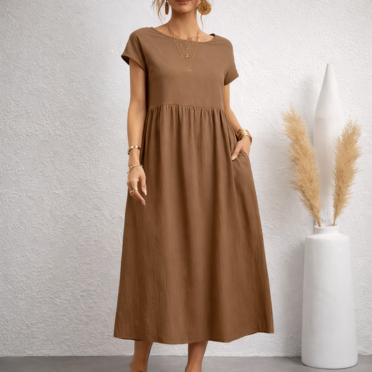 Women's brown linen midi dress with short sleeves, empire waist, side pockets and relaxed fit for casual comfort