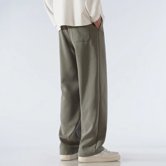 Men's olive green cotton wide-leg relaxed-fit pants with back pocket and elastic waistband, casual streetwear style