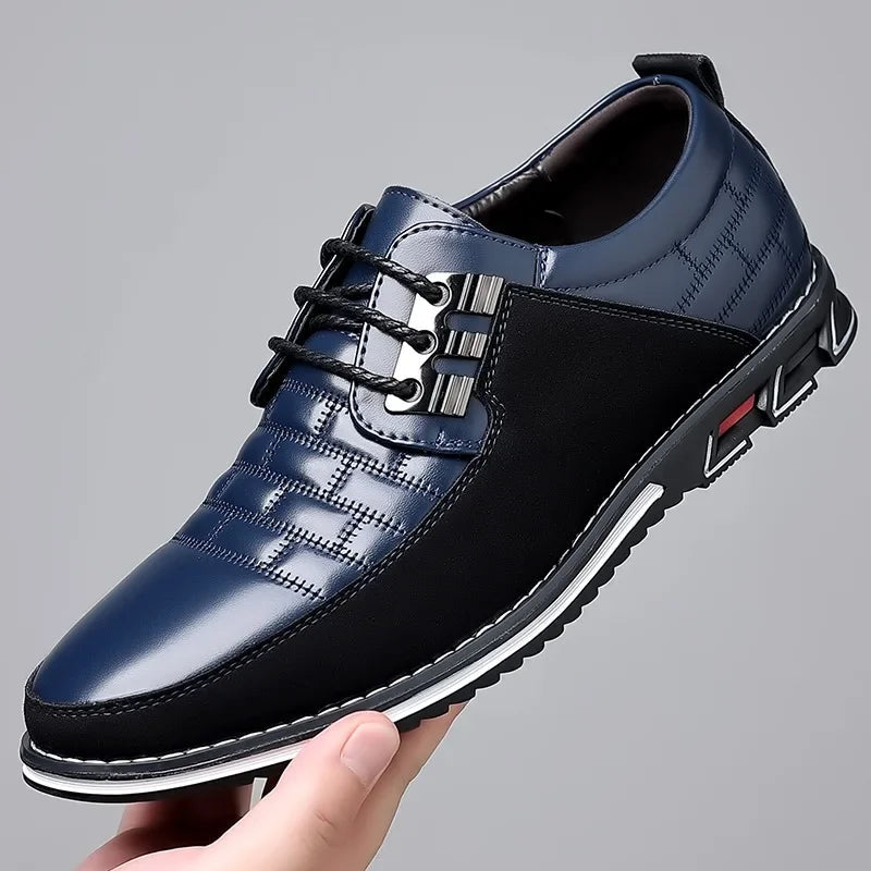 Men's blue and black leather lace-up derby dress shoes with quilted pattern, metal eyelets, and white contrast sole