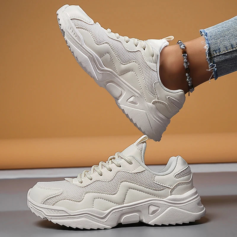 White mesh lace-up chunky platform sneakers for women with thick wavy sole and beaded ankle accessory