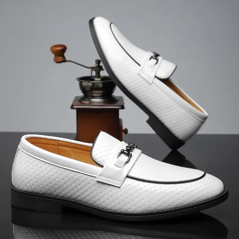 White men's leather slip-on loafers with diamond-textured upper, silver metal buckle, and black sole trim.