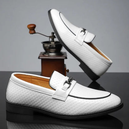 White men's leather slip-on loafers with diamond-textured upper, silver metal buckle, and black sole trim.