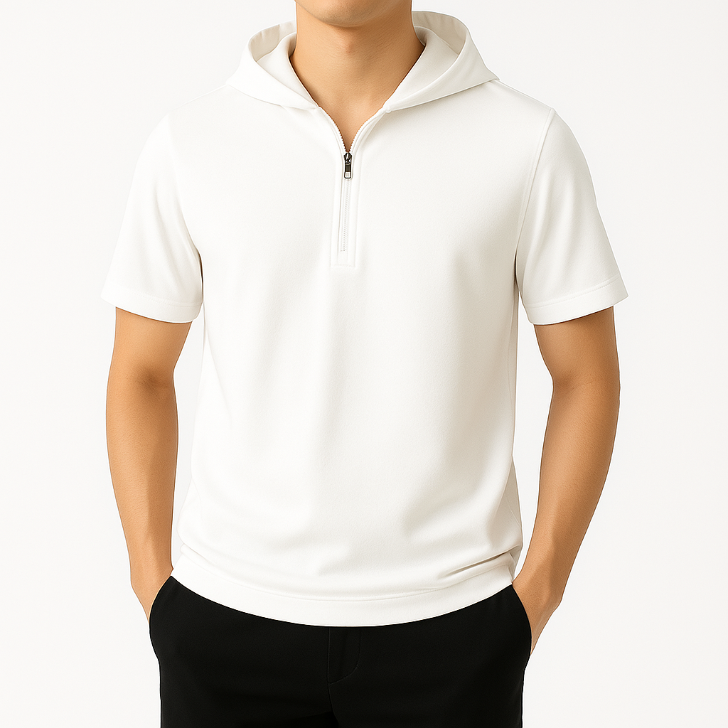 Men's white half-zip hooded short sleeve shirt in relaxed fit, paired with black pants, on white background.