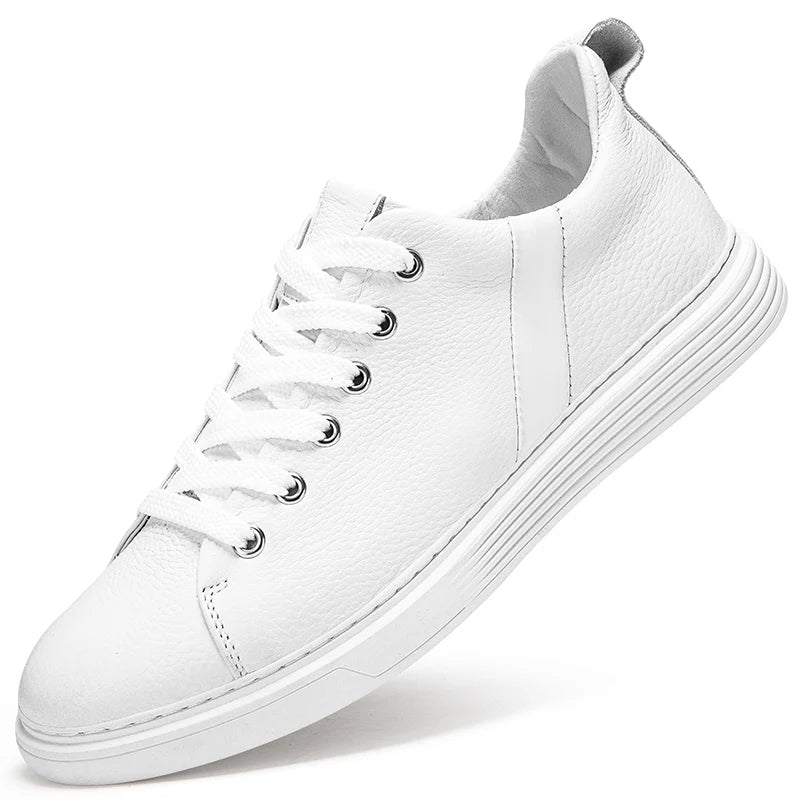 White leather low-top men's sneakers with flat laces, silver eyelets, and a clean white rubber sole