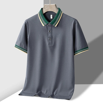 Gray men's polo shirt with green and cream striped tipped collar and matching sleeve cuffs, short sleeves, button placket