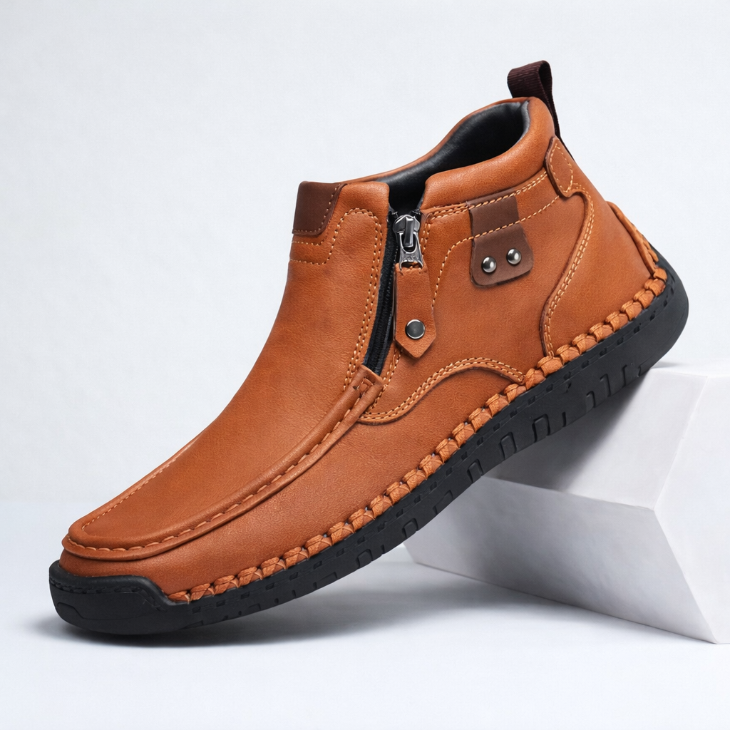 Men's brown leather ankle boots with side zipper and black rubber sole, casual slip-on design