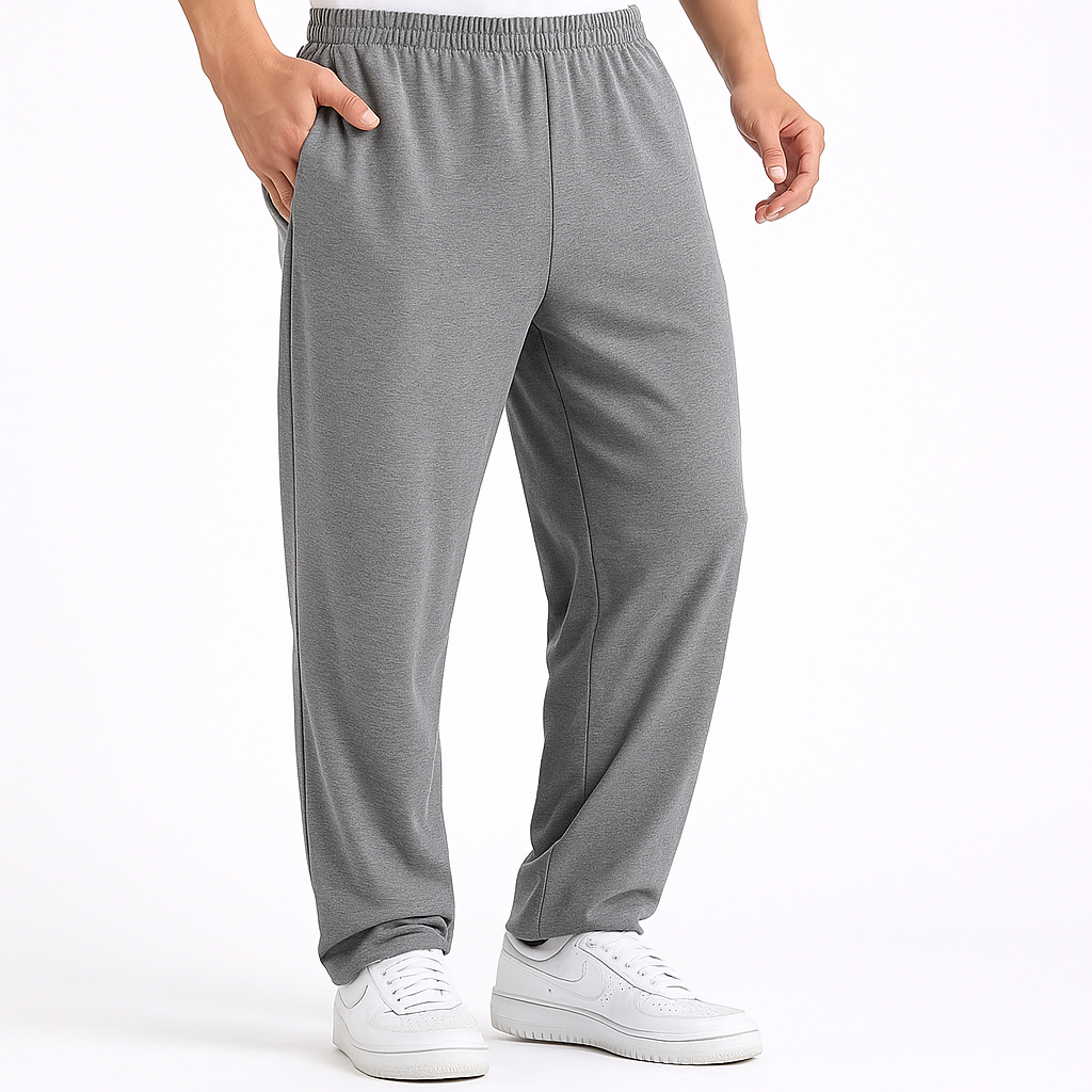 Men's grey Vex Cotton Elastic Waist Sweatpants with side pockets, straight leg fit, paired with white sneakers.