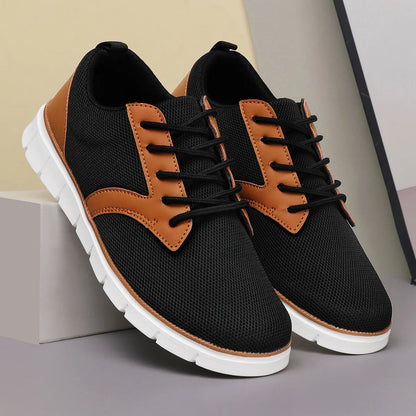 Black and tan canvas leather orthopedic sneakers with lace-up closure and white cushioned sole for women.