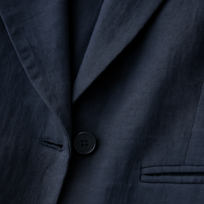 Navy blue women's linen blazer jacket featuring notch lapels, single button closure, and welt pockets.