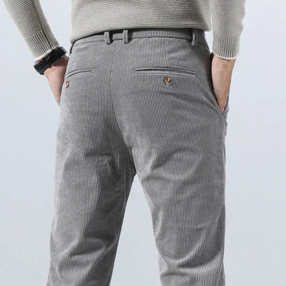 Men's gray corduroy slim fit dress pants with belt loops and back pockets, business casual style