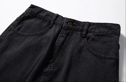 Dark gray relaxed-fit men's denim jeans showing waistband, belt loops, front pockets, and brass button closure.
