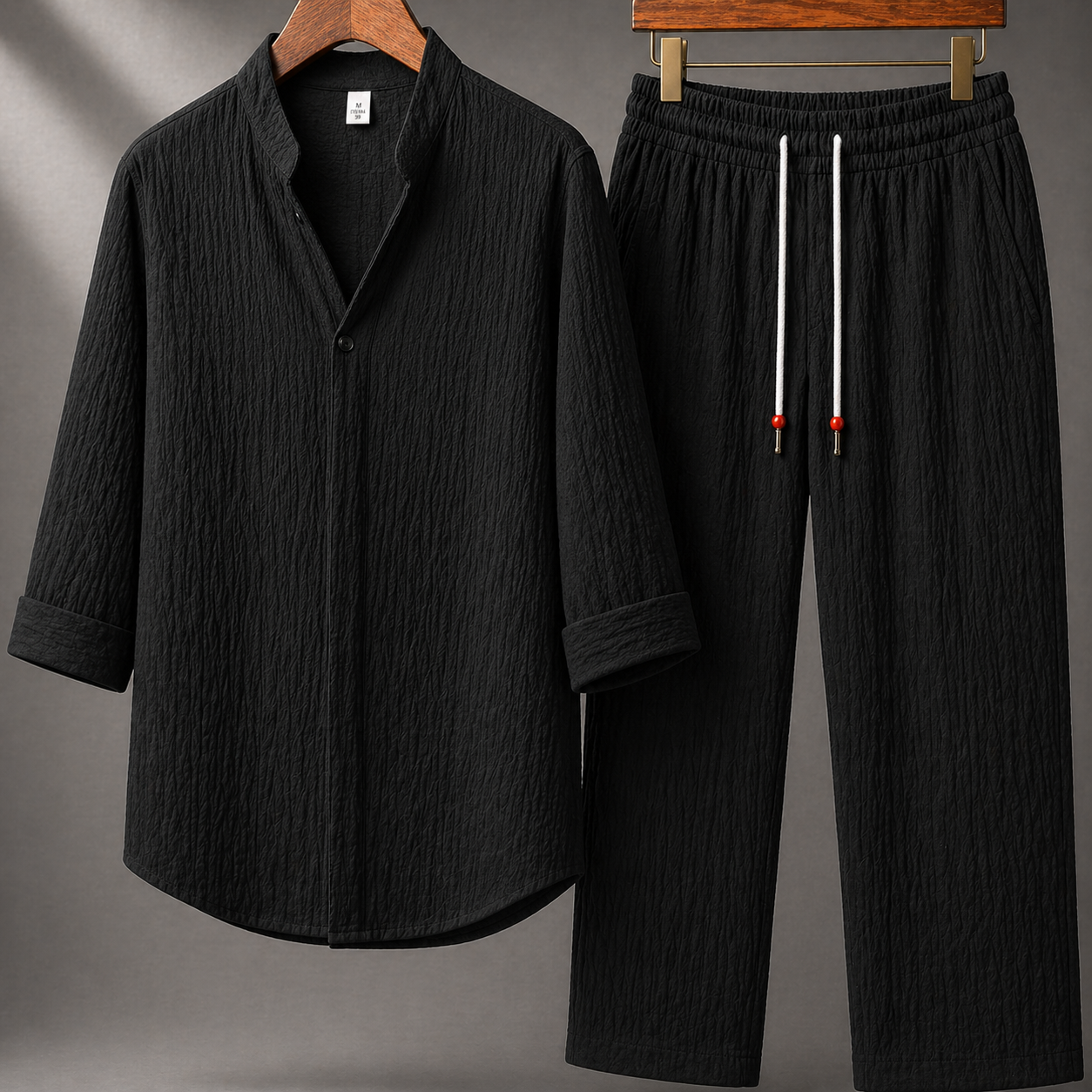Black textured cotton linen men's two-piece set with mandarin collar shirt and drawstring wide-leg pants