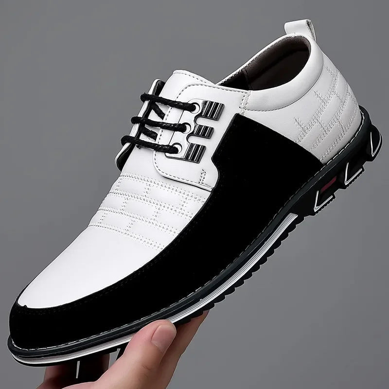 Men's black and white two-tone leather lace-up derby dress shoes with metallic eyelets and chunky sole