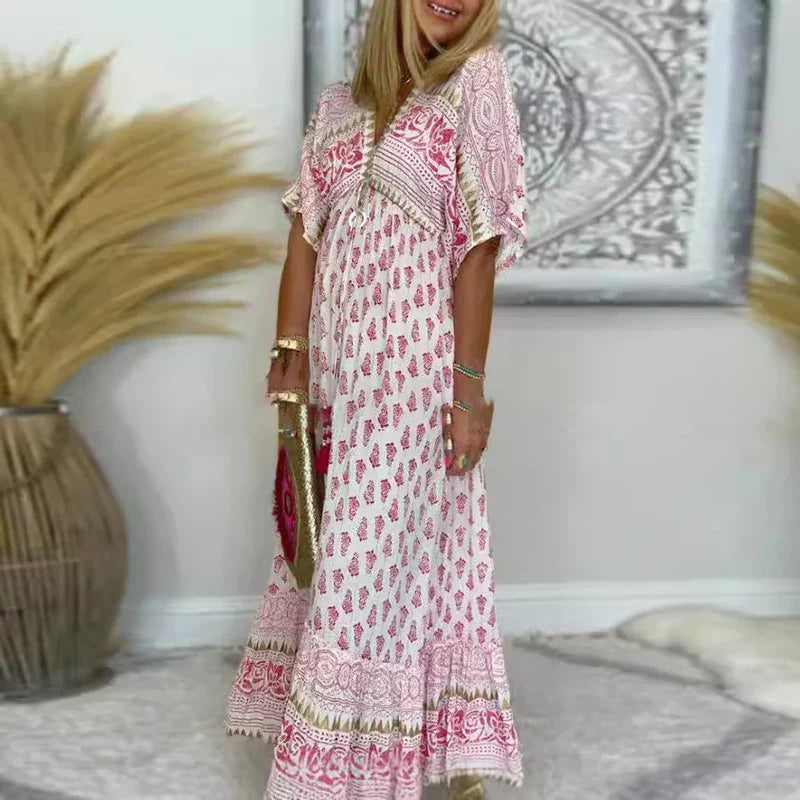 Women's pink and white paisley print boho maxi dress with short sleeves and tiered hem