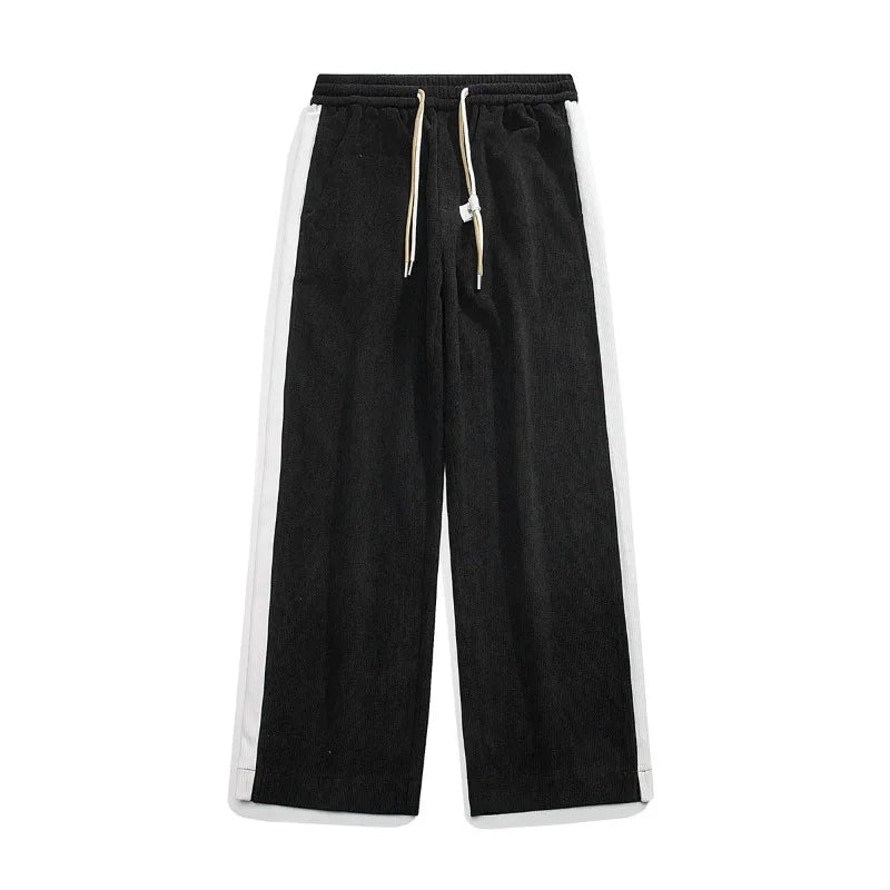 Black wide-leg corduroy joggers with white side stripes, elastic waistband, and cream drawstring closure