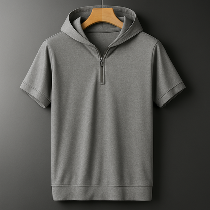 Gray men's relaxed fit short-sleeve hooded shirt with half-zip neckline, displayed on wooden hanger against dark background.