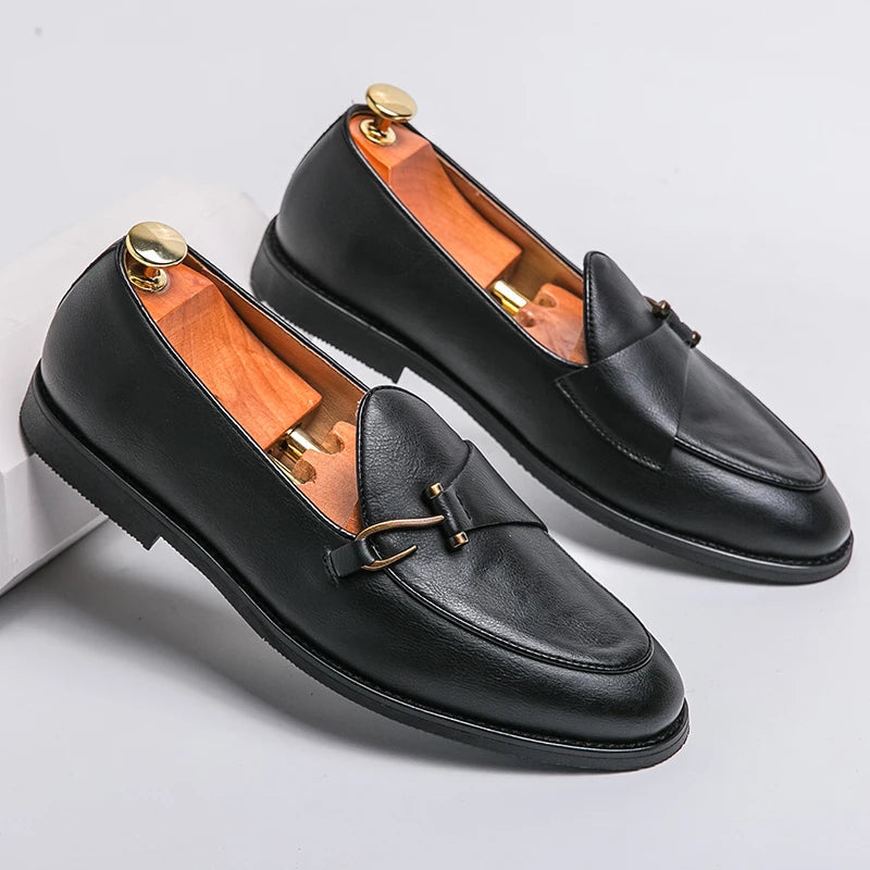 Black leather men's loafers with gold metal buckle detail and wooden shoe trees