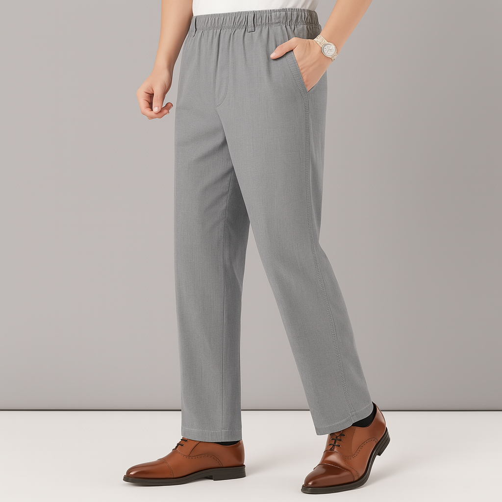 Men's gray linen drawstring pants with elastic waistband and side pockets, styled with brown leather dress shoes