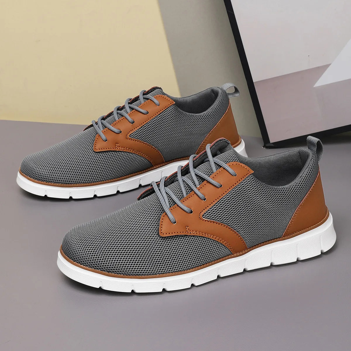 Gray and brown canvas leather orthopedic sneakers with lace-up closure and white cushioned sole, casual style.