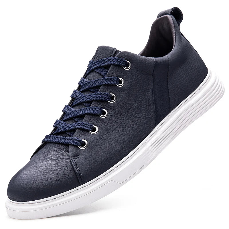 Navy blue leather low-top sneakers with white sole and lace-up design for men