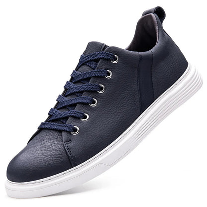 Navy blue leather low-top sneakers with white sole and lace-up design for men