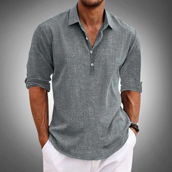 Men's gray linen henley shirt with rolled sleeves and button placket paired with white pants