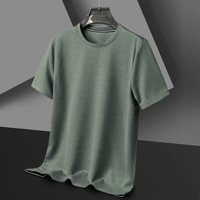 Sage green men's waffle knit crewneck t-shirt with short sleeves, displayed on hanger against gray background.