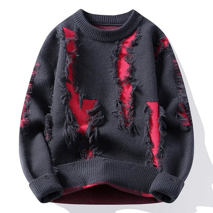 Dark gray men's distressed knit pullover sweater with red panels and frayed tassel details, crew neck style