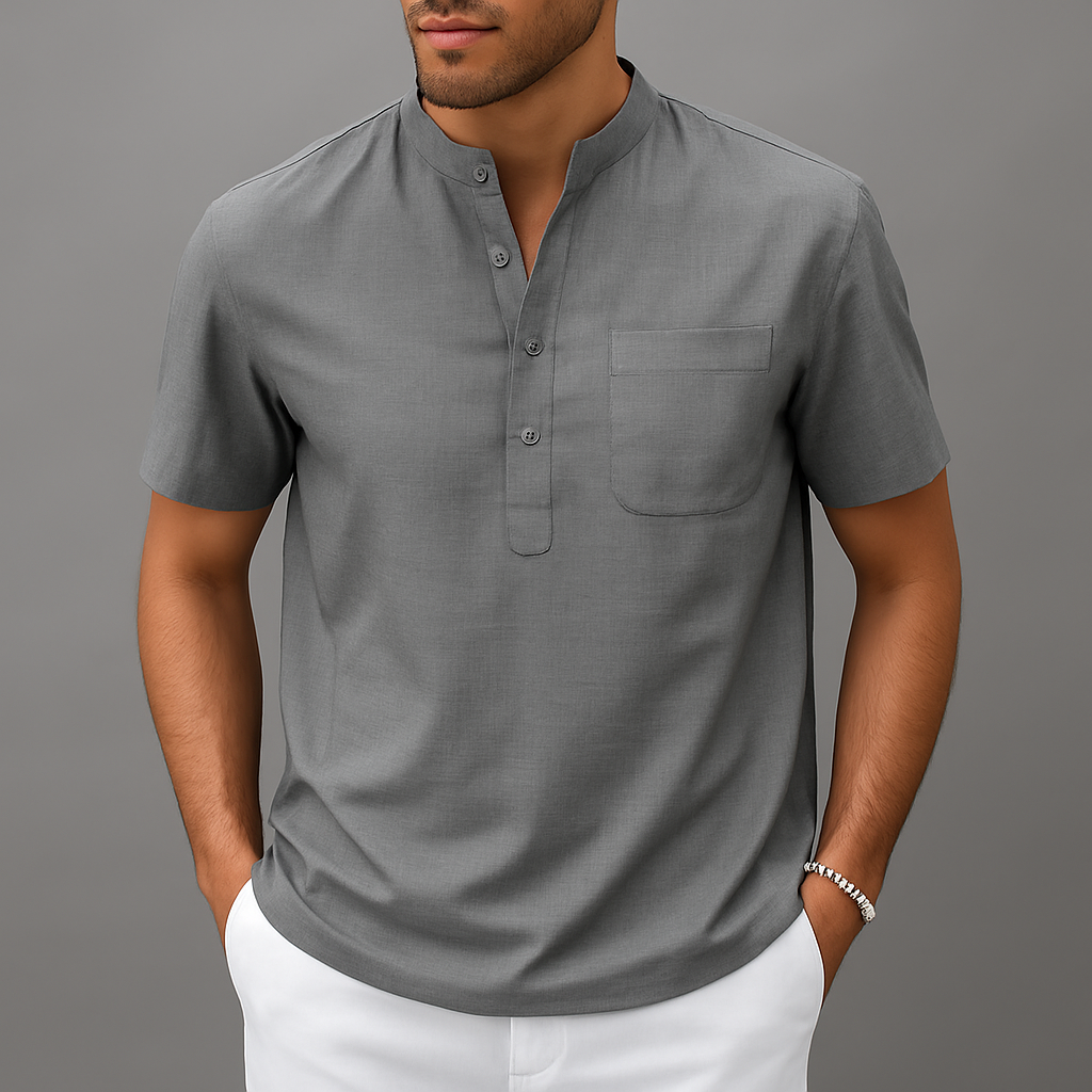 Men's gray linen band collar henley shirt with short sleeves, chest pocket, and partial button placket, paired with white pants.