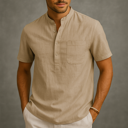 Men's beige linen band collar henley shirt with short sleeves and chest pocket on neutral background