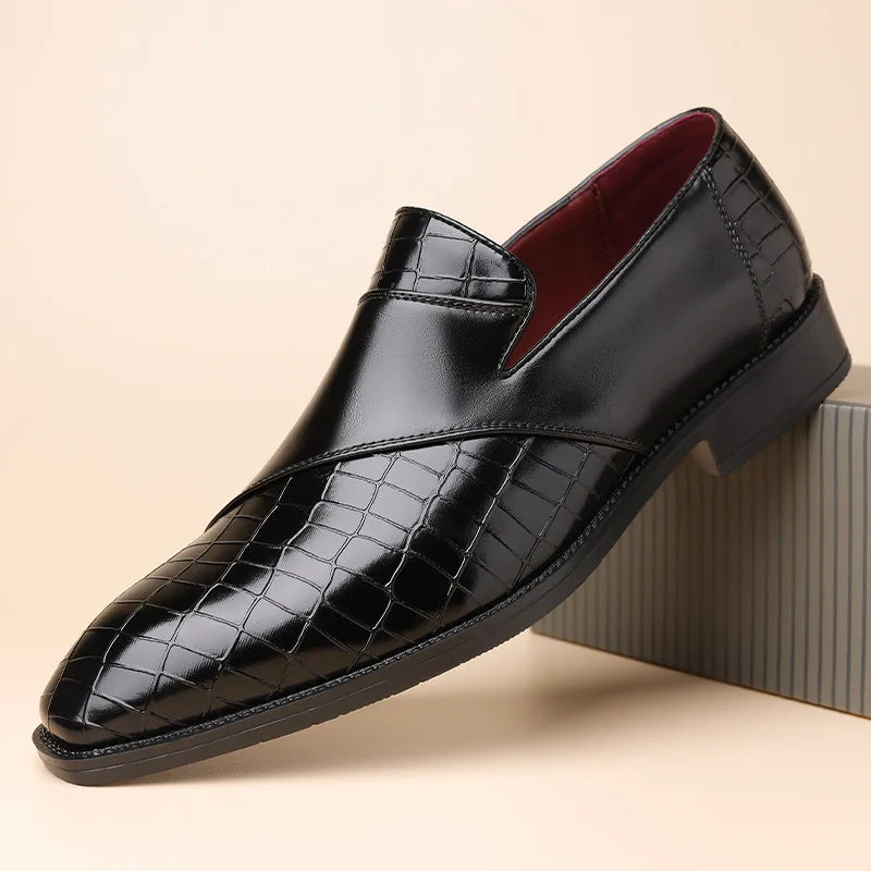 Black men's slip-on leather loafer with crocodile-embossed texture, smooth vamp panel, and burgundy interior lining.