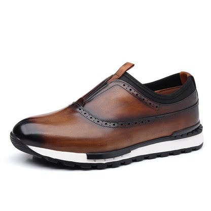 Brown leather men's slip-on loafer with brogue detailing, elasticated top, and white rubber sneaker sole.