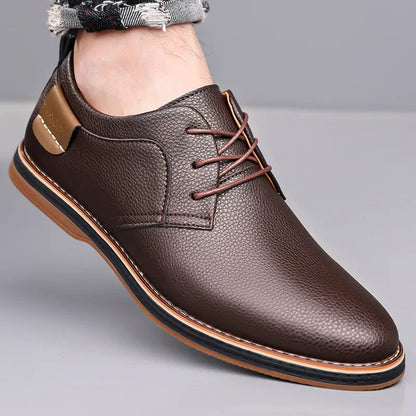 Brown men's leather lace-up derby shoes with pebbled texture, tan sole detail, worn with distressed jeans.