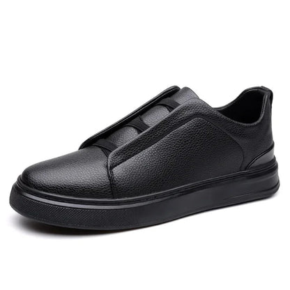 Black men's leather slip-on sneakers with elastic strap, pebbled texture upper, and thick rubber sole.