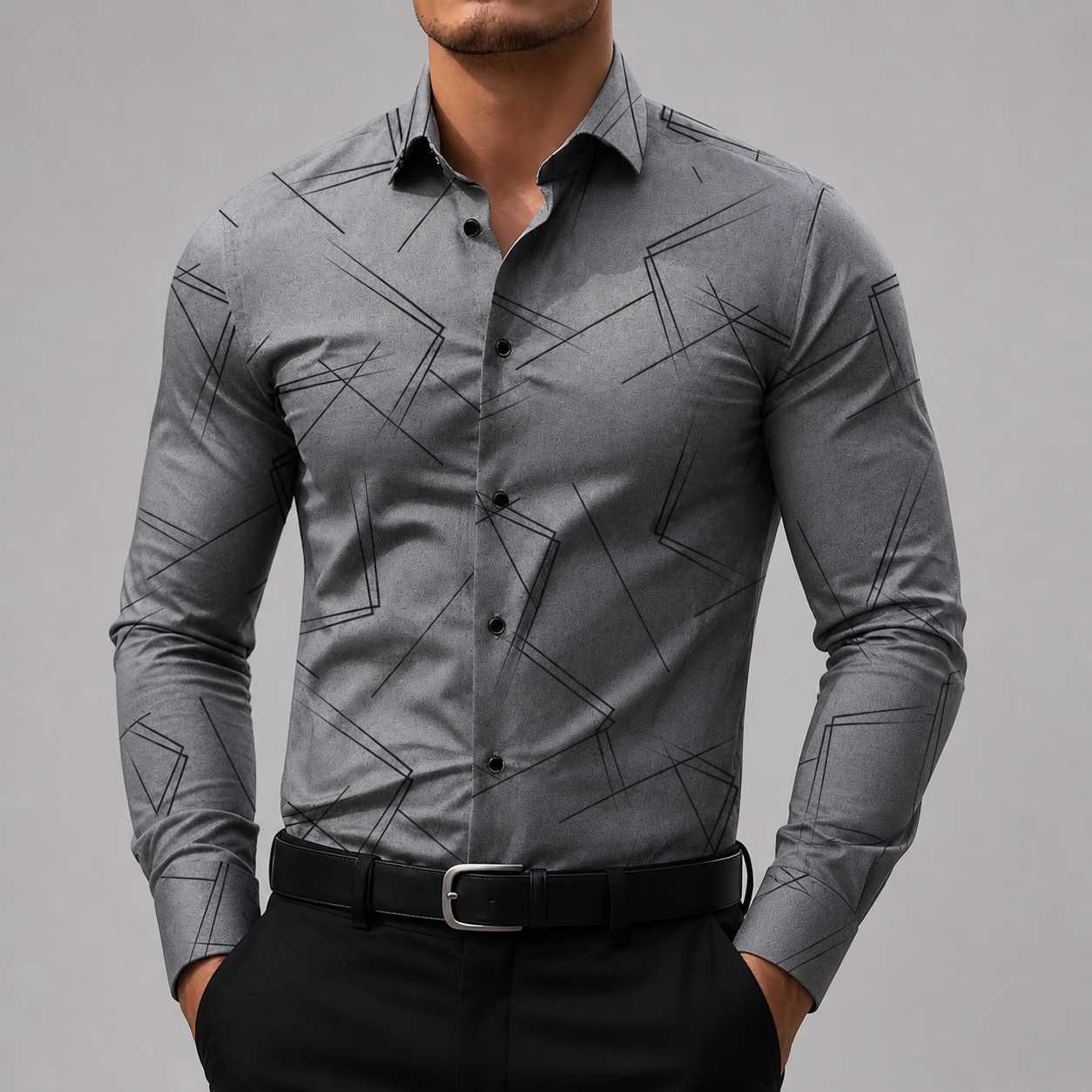 Men's slim-fit gray button-up shirt with black geometric line print, black buttons, worn with black trousers and belt.