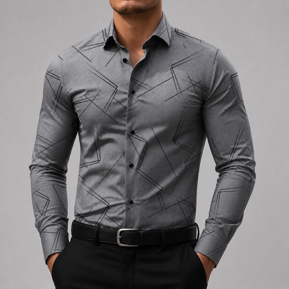 Men's slim-fit gray button-up shirt with black geometric line print, black buttons, worn with black trousers and belt.