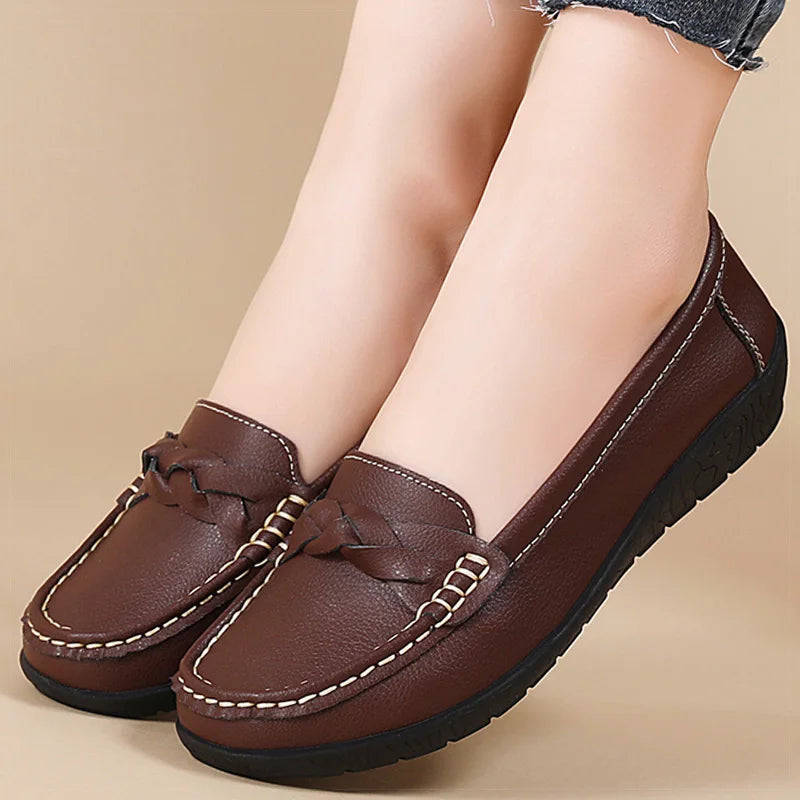 Brown leather slip-on loafers with braided bow detail and white contrast stitching for women