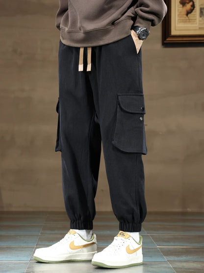 Black cargo joggers with elastic cuffs and utility pockets for men, tapered fit casual streetwear pants
