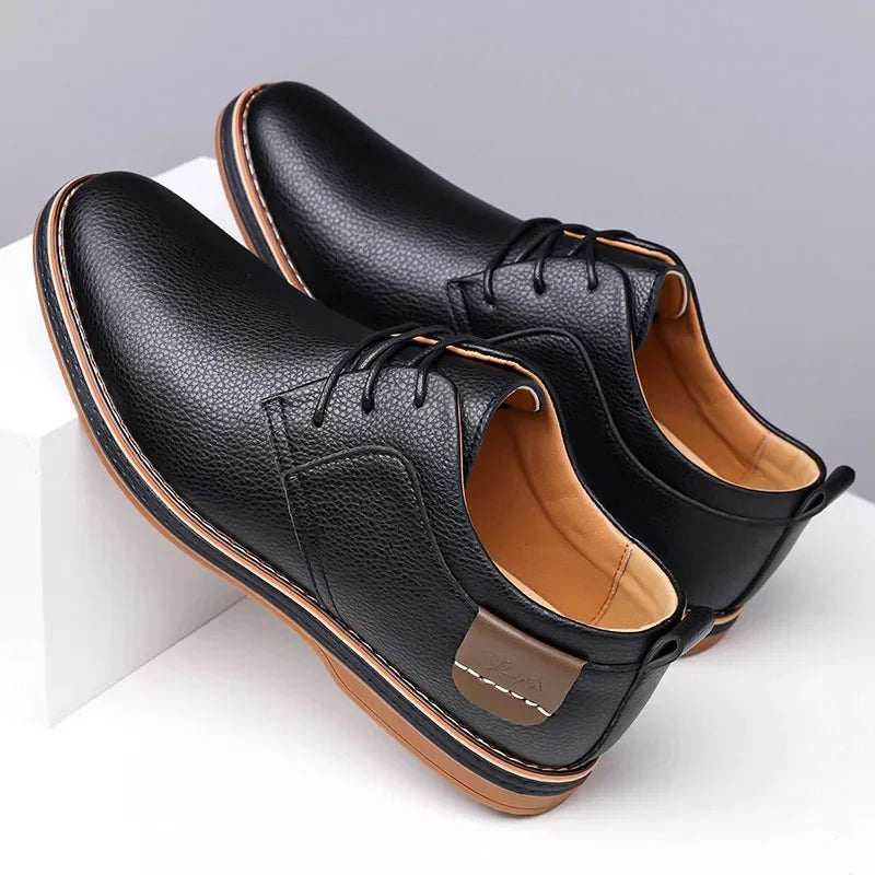 Black men's leather lace-up Derby shoes with tan sole and interior lining displayed on white surface