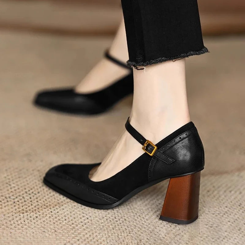 Black women's square toe leather Mary Jane pumps with gold buckle ankle strap and brown block heel