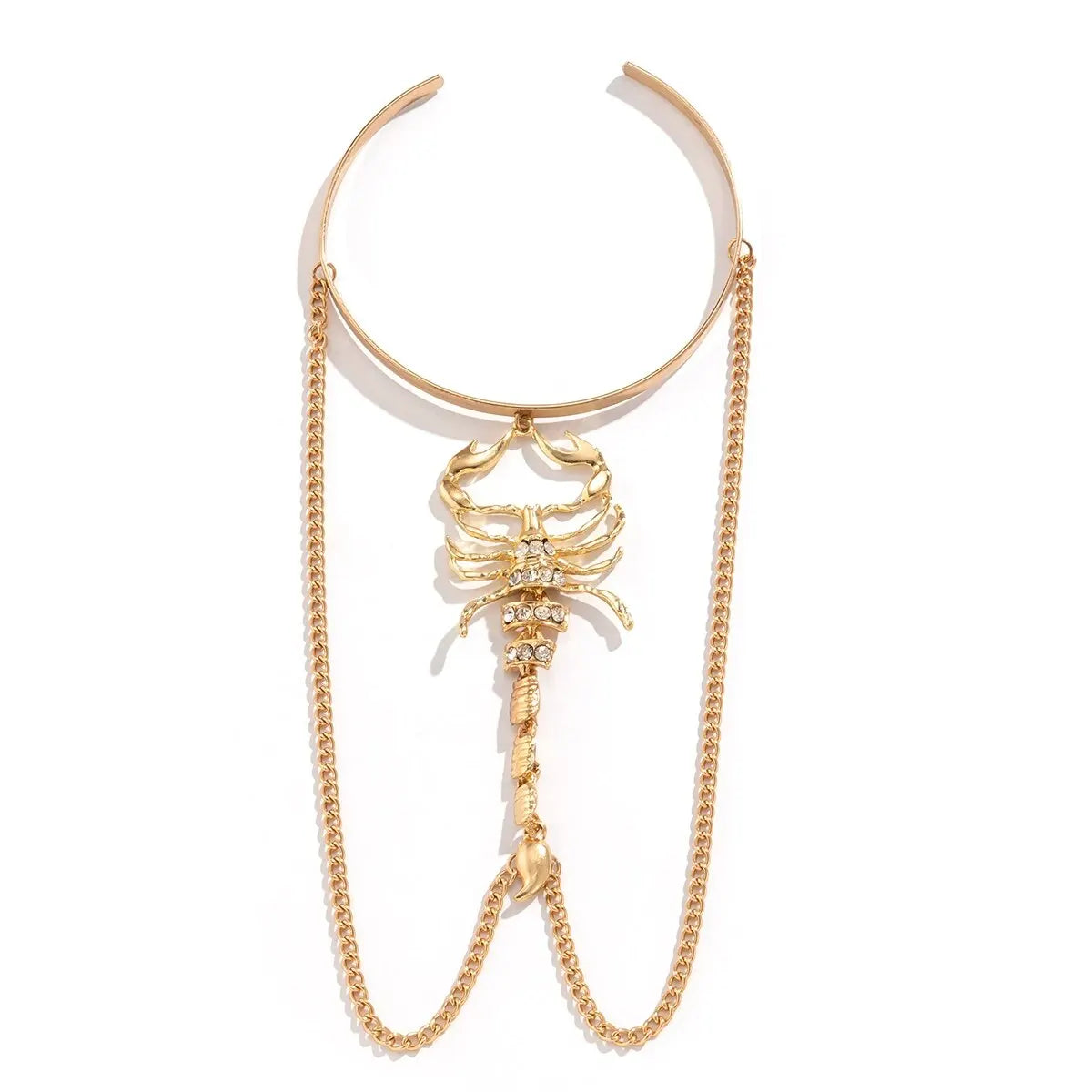 Gold open cuff upper arm bracelet featuring crystal-embellished scorpion pendant with dangling chain accents