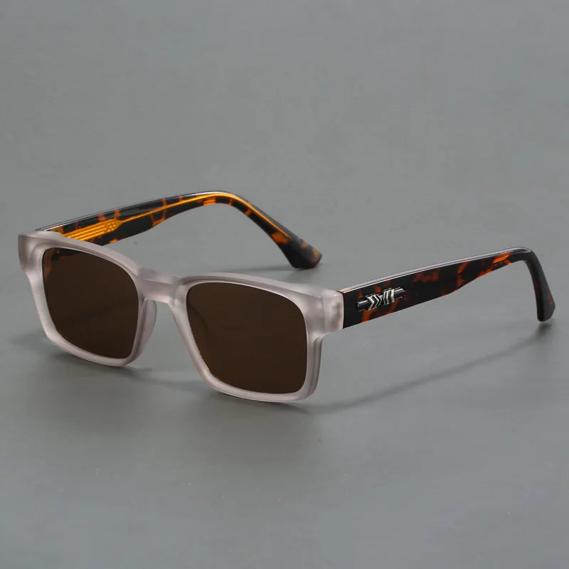 Rectangular sunglasses with frosted gray frame, tortoiseshell temples, dark brown lenses, and silver arrow hinge detail.